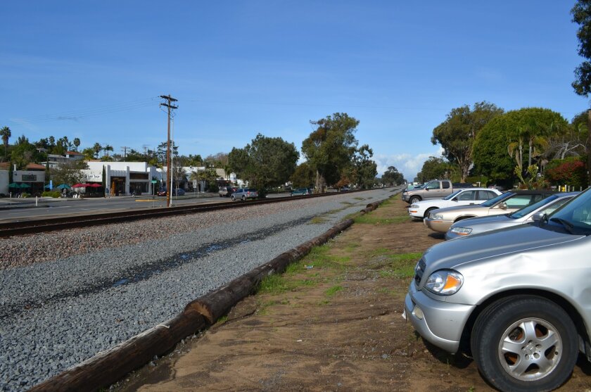 It’s common to spot parked cars along the railway in Leucadia. As part of a new rail agreement, the city and North County Transit District want to establish formal parking lots.