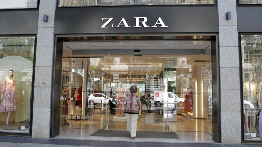 A shopper enters a Zara store in Madrid in June.
