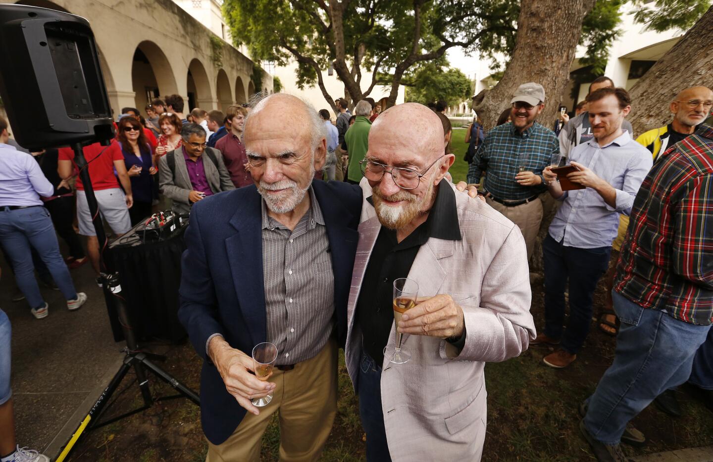 Caltech physicists Barry Barish, left, and Kip Thorne celebrate their Nobel Prize in physics for the LIGO experiment at a party at the Pasadena university.
