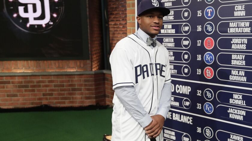 Xavier Edwards, a shortstop from North Broward Preparatory High School in Florida, reacts after being selected No. 38 by the San Diego Padres during the first round of the Major League Baseball draft Monday, June 4, 2018, in Secaucus, N.J.
