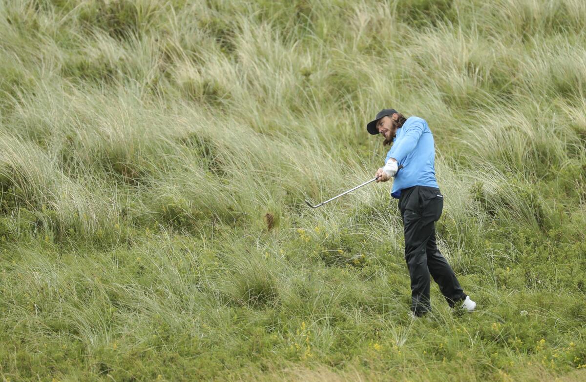 Tommy Fleetwood plays from the rough on the seventh hole during the final round of the British Open on Sunday.