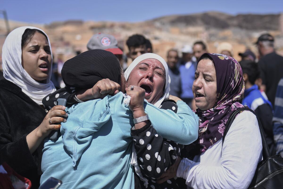 Women crying in mourning for earthquake victims