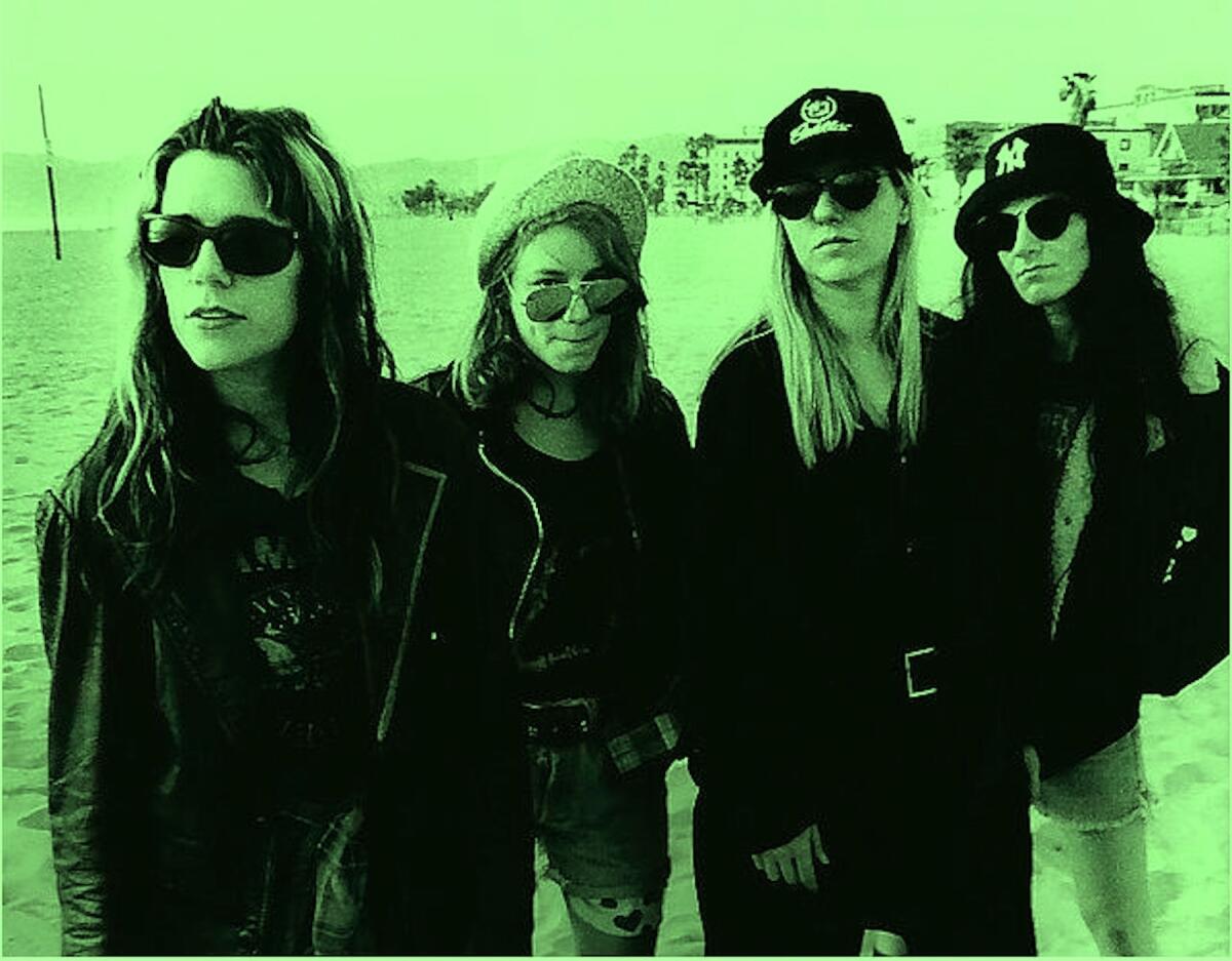 members of the punk band L7 at Santa Monica beach in 1992.