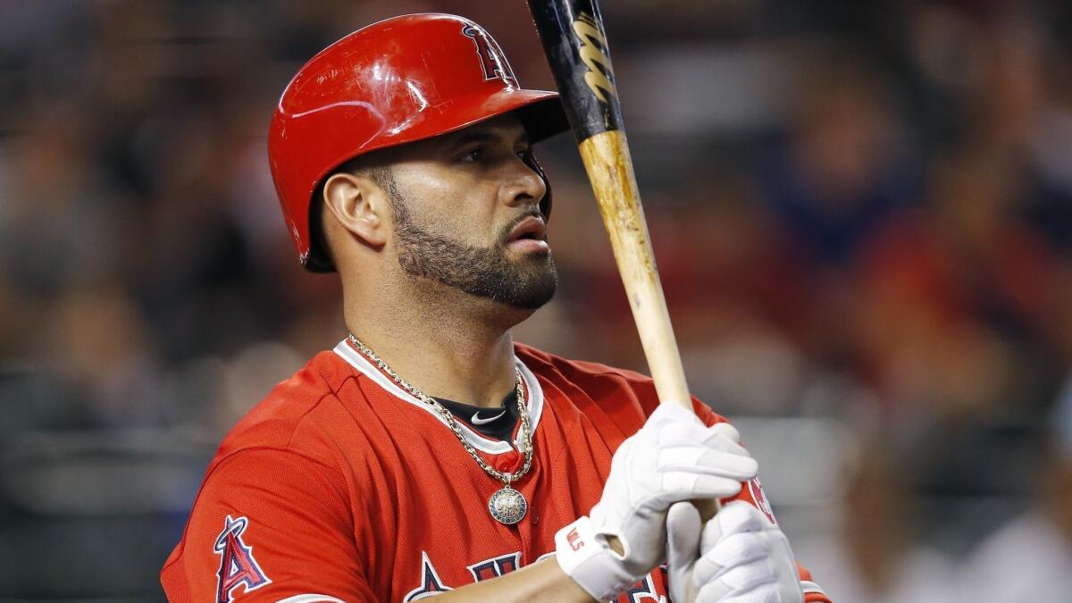 Strike Out Slavery, an organization founded by Angels first baseman Albert Pujols and his wife, Deidre, is receiving a $500,000 donation from Major League Baseball and the MLB Players Assn.
