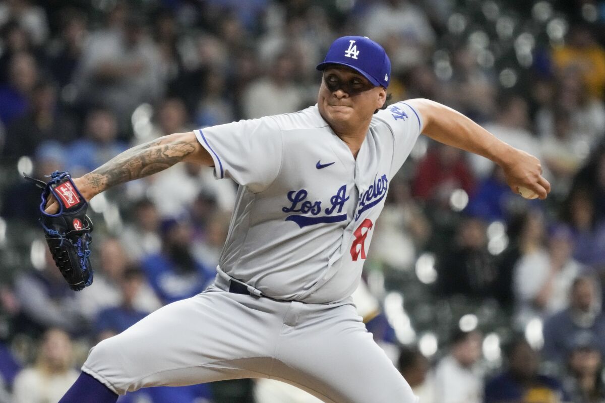 Dodgers relief pitcher Victor Gonzalez throws during the sixth inning against the Milwaukee Brewers.