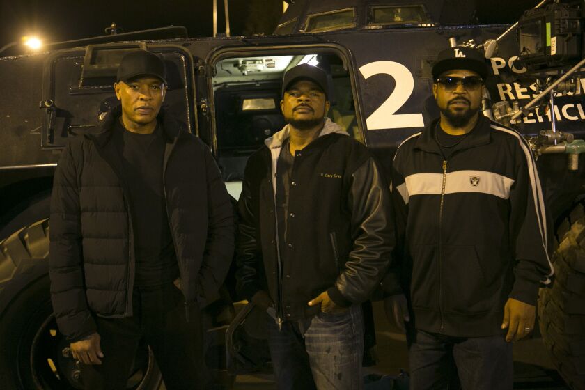 Producer Dr. Dre, left, director/producer F. Gary Gray and producer Ice Cube on the set of "Straight Outta Compton."