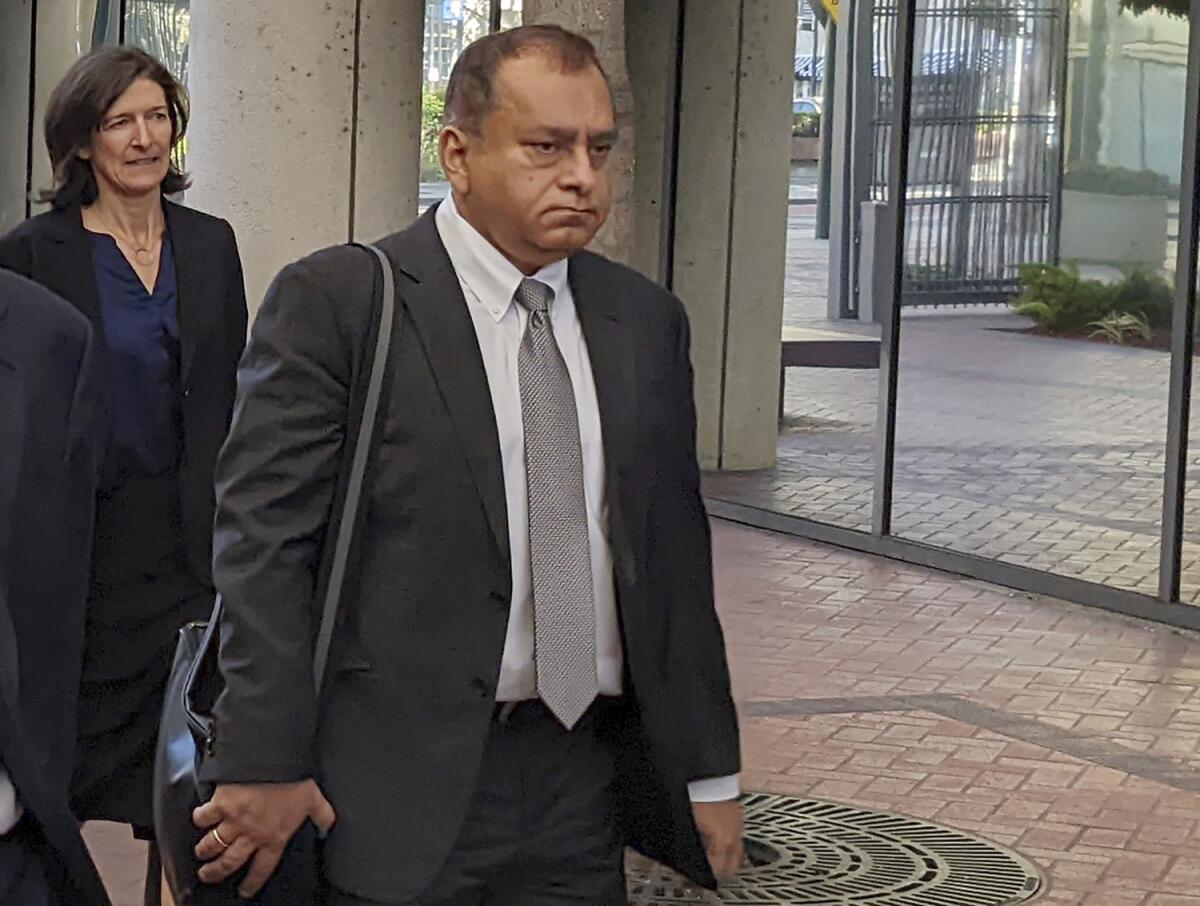 Ramesh "Sunny" Balwani walks into federal court in San Jose.