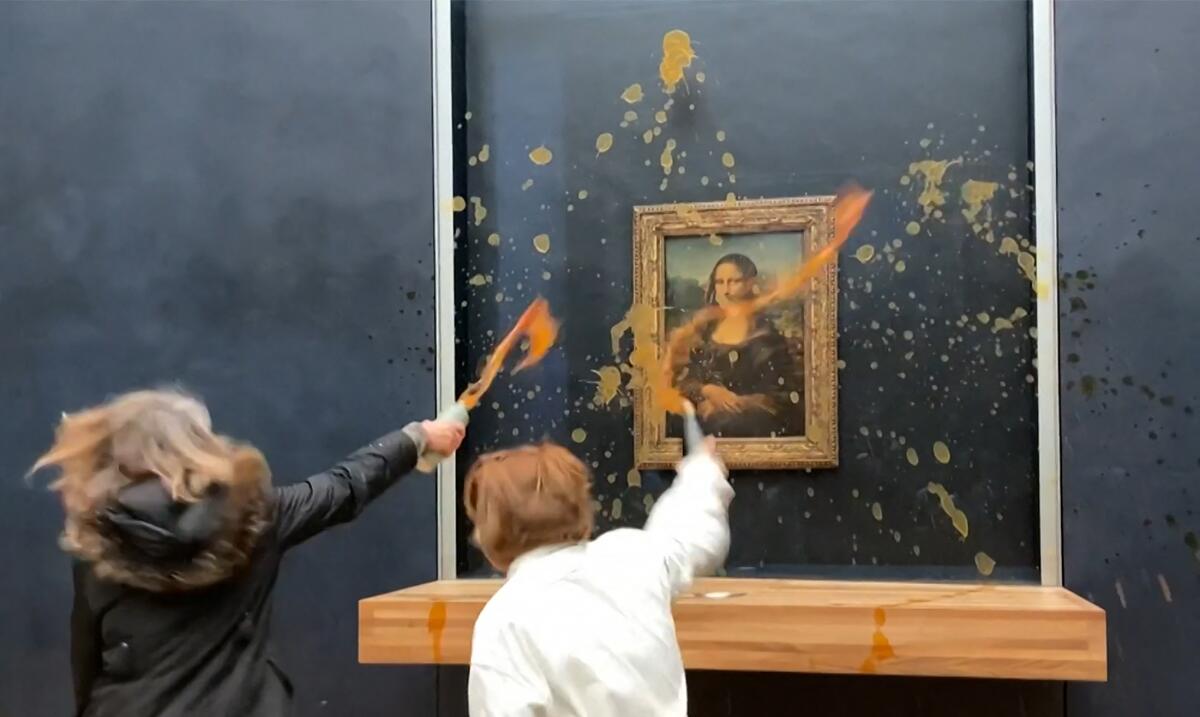 Environmental activists throw soup at Leonardo da Vinci's "Mona Lisa" painting at the Louvre museum in Paris on Jan. 28. 