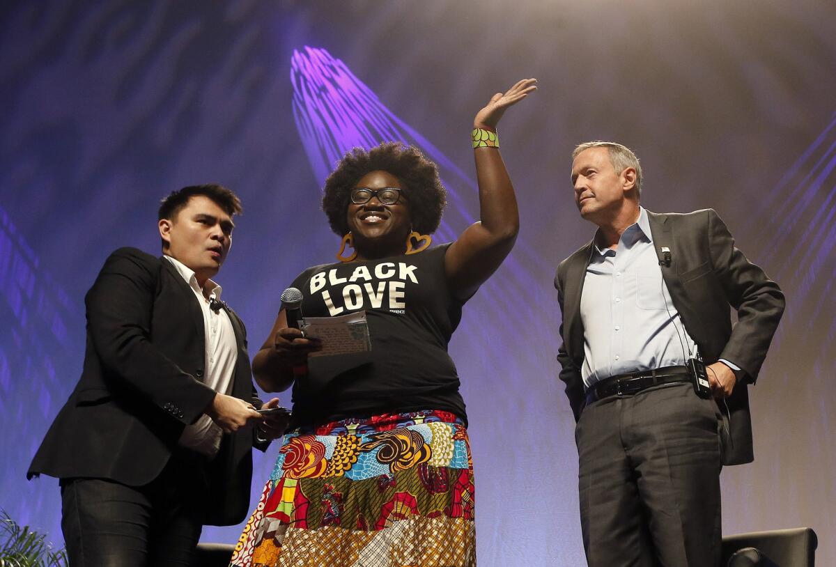 Activist Tia Oso, center, joins Democratic presidential candidate Martin O'Malley, right, and moderator Jose Antonio Vargas onstage at a Netroots Nation town hall meeting last weekend.