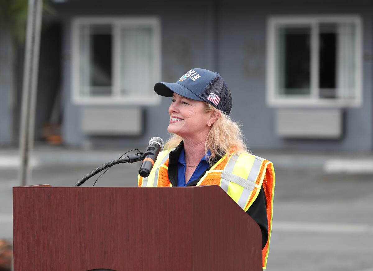 Mayor Ashleigh Aitken speaks at a press conference before a demolition crew took down the Rainbow Inn along Beach Boulevard.