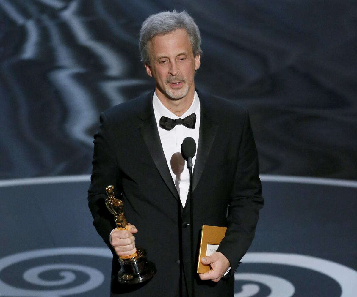 William Goldenberg wins an Oscar for film editing with "Argo" during the 85th annual Academy Awards on Feb. 24, 2013.