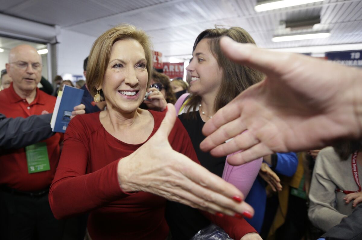 GOP presidential candidate Carly Fiorina, seen here greeting supporters at a Republican event in Michigan on Saturday, got top marks in a new poll for her performance in Wednesday's debate.