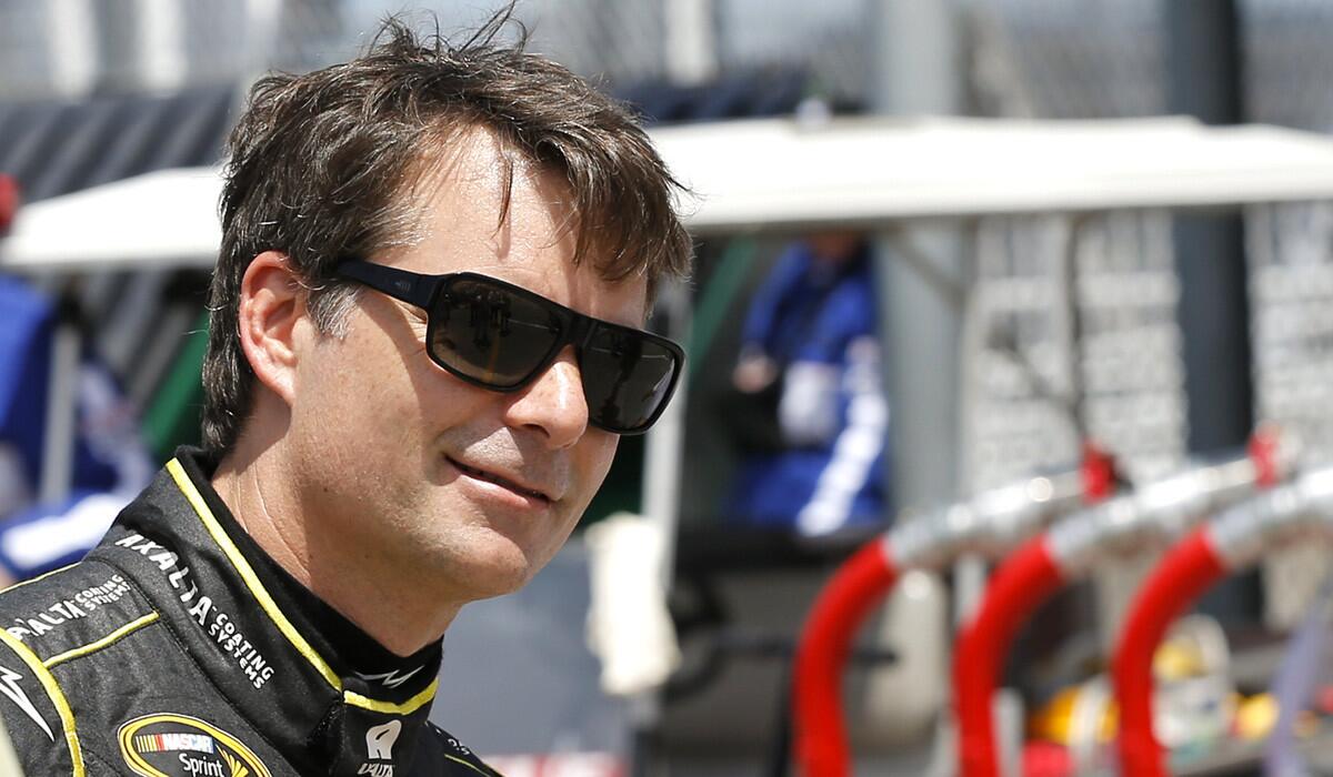Jeff Gordon heads to his garage during a NASCAR Sprint Cup practice session at Daytona International Speedway on Friday.