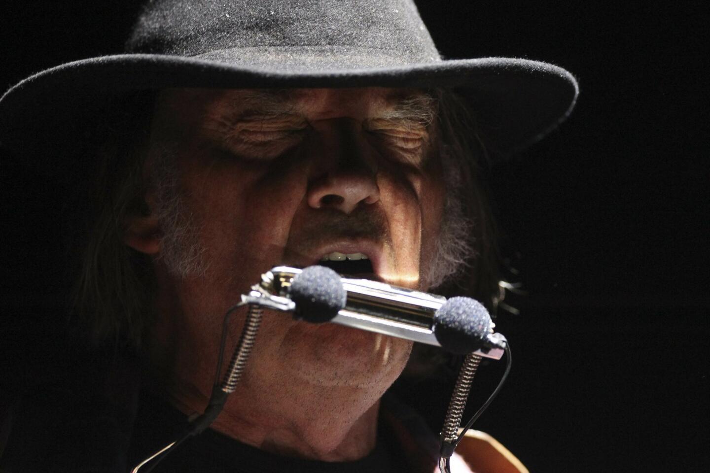 Neil Young performs at the RIMAC Arena.