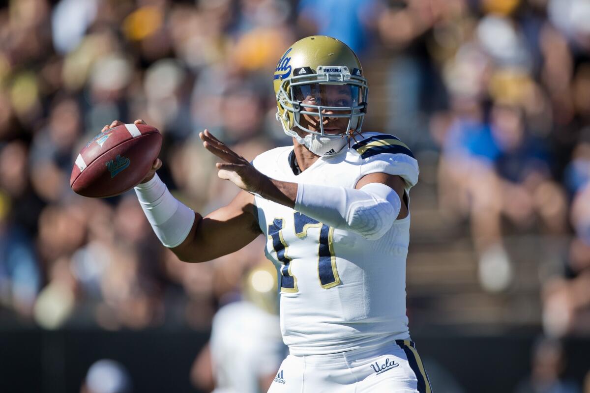 UCLA quarterback Brett Hundley passes during the first half of a game against Colorado on Oct. 25. The Bruins beat the Buffaloes, 40-37, in double overtime.