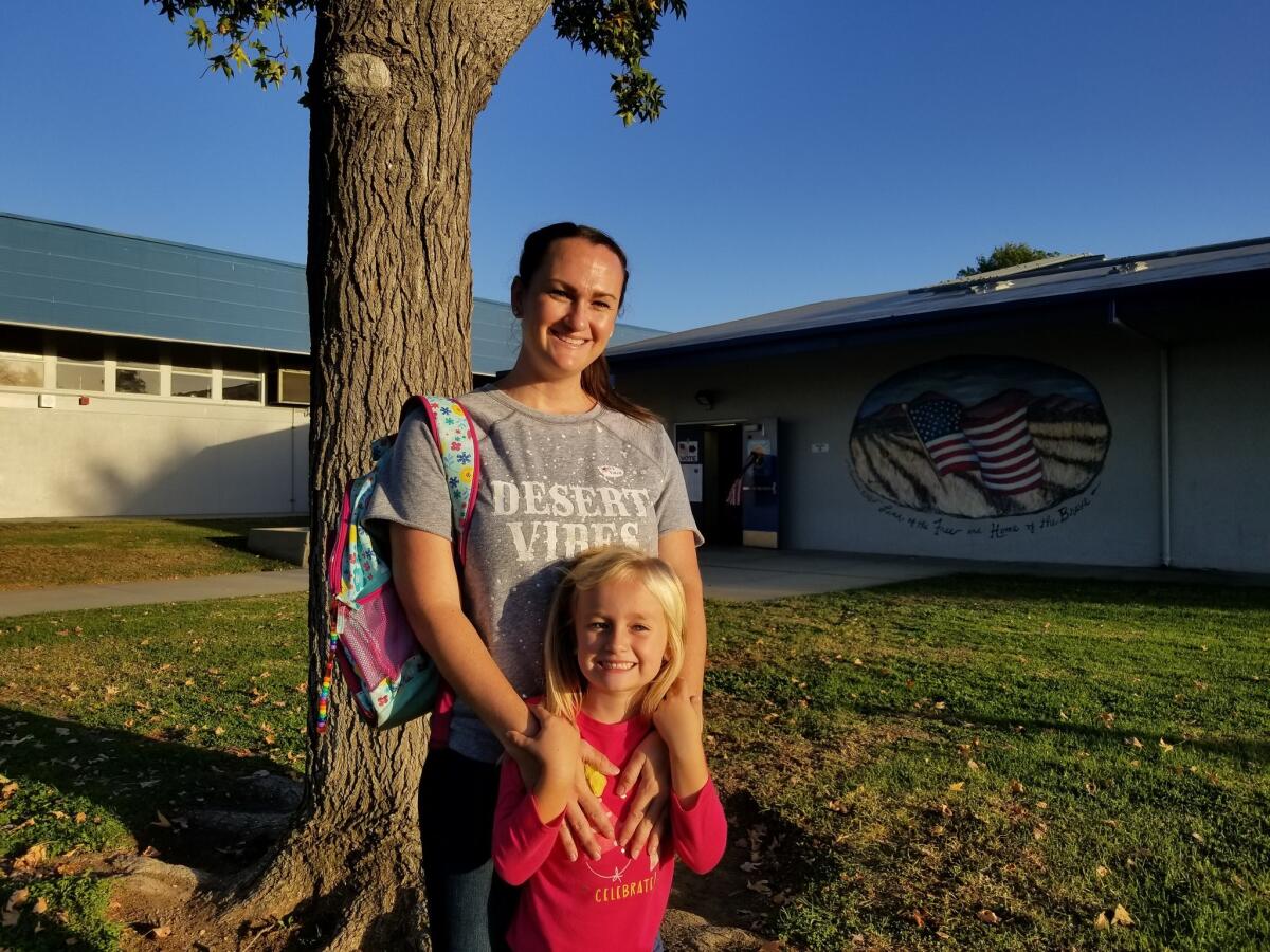 Lacey Kraft, 34, and her daughter, Lexie, go to the polls in Fullerton.