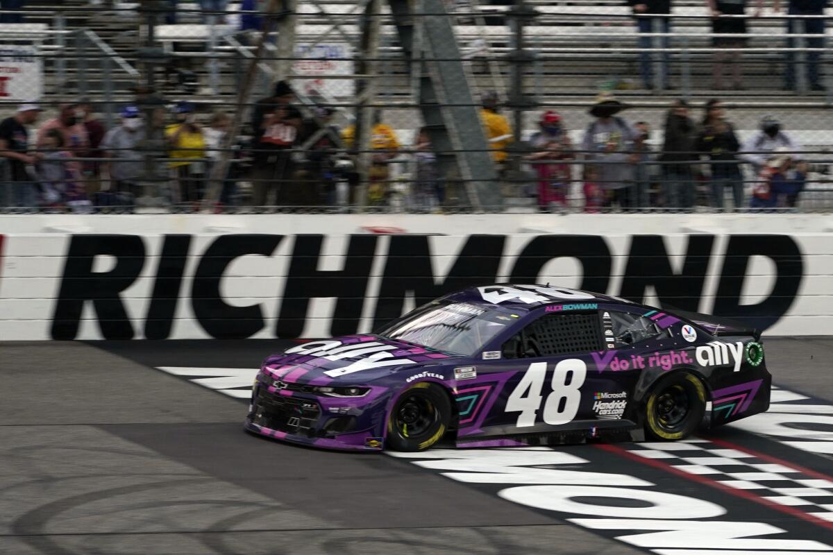 Alex Bowman (48) crosses the start/finish line to win a NASCAR Cup Series auto race at Richmond International Raceway.