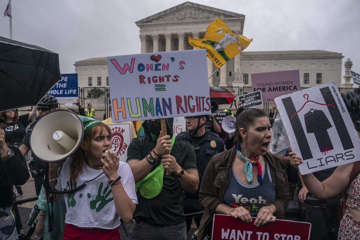 Abortion-rights activists chant during a rally in front of the Supreme Court on June 23 