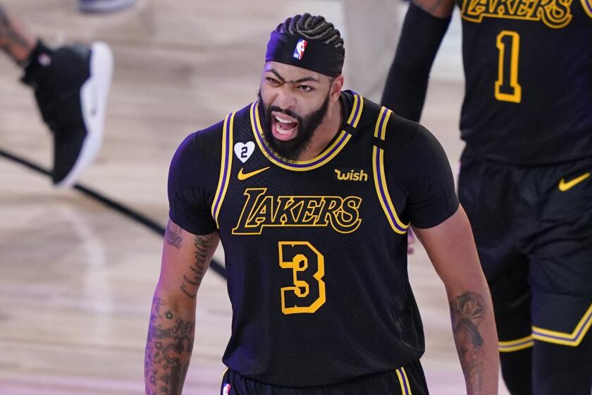 Los Angeles Lakers' Anthony Davis (3) celebrates after an NBA conference final playoff basketball game.