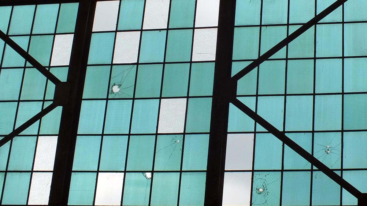 Nearly 75 years after the Japanese attack on Pearl Harbor, bullet holes remain in the windows of a hangar at the Pacific Aviation Museum on Oahu's Ford Island.