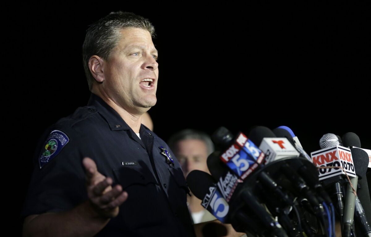 San Bernardino Police Lt. Mike Madden speaks to reporters near the site of the rampage.