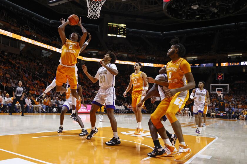 Tennessee forward Julian Phillips (2) shoots past Alcorn State forward Darryl Jordan (20) during the first half of an NCAA college basketball game Sunday, Dec. 4, 2022, in Knoxville, Tenn. (AP Photo/Wade Payne)