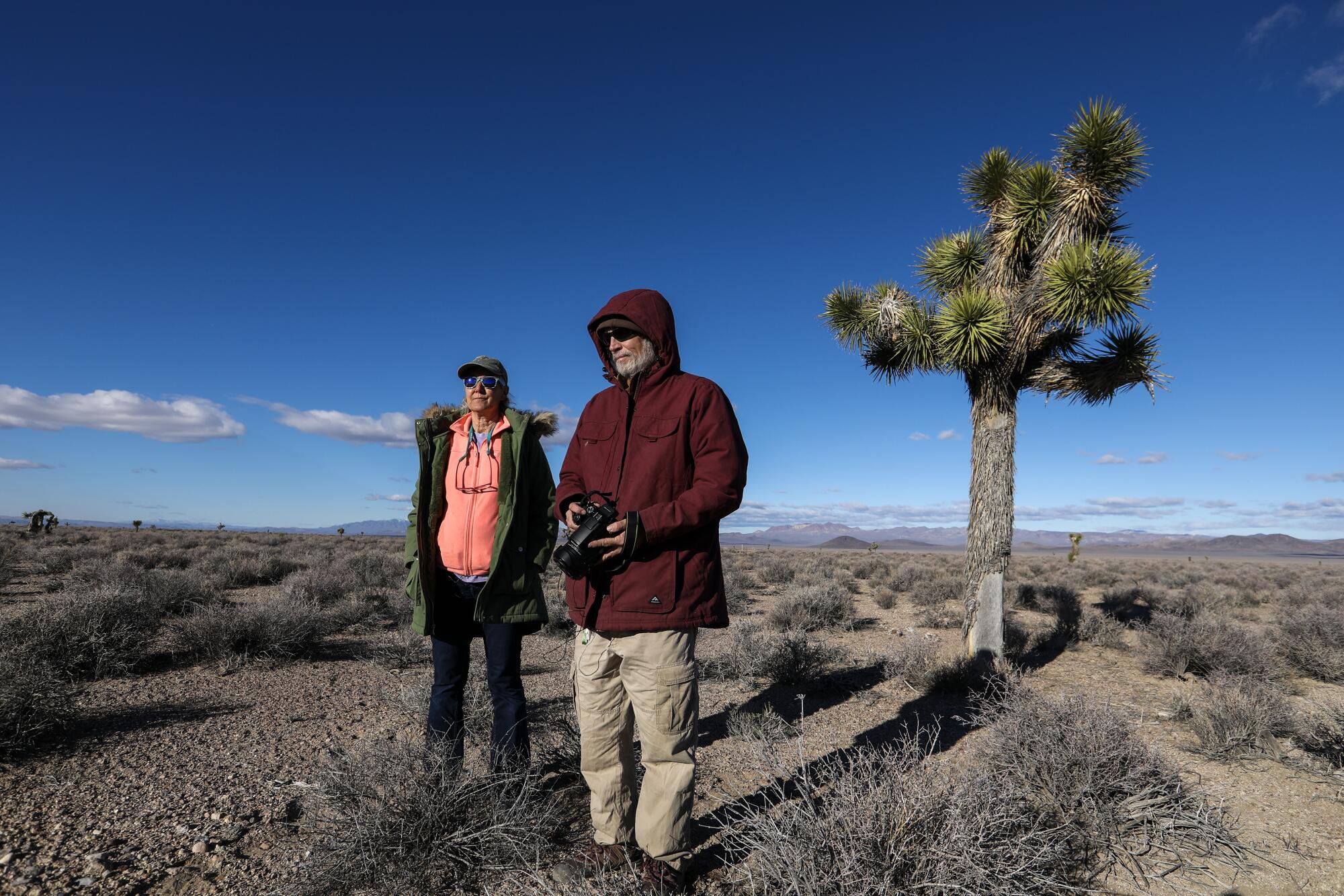 Laura Cunningham, left, and Kevin Emmerich visit Sarcobatus Flat near Beatty, Nev.