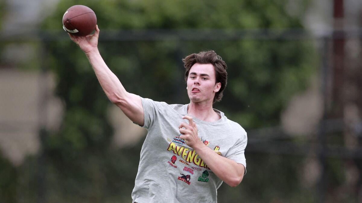 Incoming USC freshman quarterback JT Daniels passes at Golden West College on May 30.