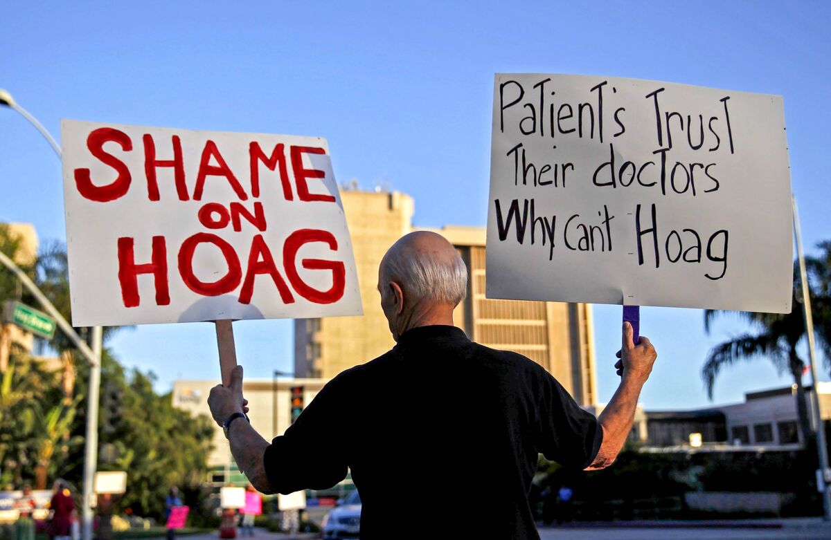 An abortion rights advocate demonstrates outside Hoag Memorial Hospital in 2013.