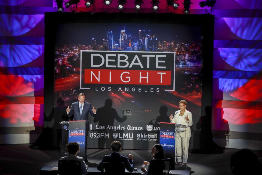 Los Angeles, CA - September 21: Rep. Karen Bass, right, and developer Rick Caruso start of the Los Angeles mayoral debate ahead of the Nov. 8 general election at the Skirball Cultural Center in Los Angeles, Wednesday, Sept. 21, 2022. The Los Angeles Times, Fox 11 LA, Univision 34, KPCC, the Skirball Cultural Center, the Los Angeles Urban League and Loyola Marymount University co-host back-to-back debates with the leading candidates in the L.A. mayoral and L.A. County Sheriff races. Los Angeles County Sheriff debate includes Sheriff Alex Villanueva and retired Long Beach Police Chief Robert Luna. The evening aims to be informative for Angelenos ahead of the Nov. 8 general election, which will include the runoff for the next mayor and sheriff. The debates will be co-moderated by Times Columnist Erika D. Smith and Fox 11 News Anchor Elex Michaelson. Additionally, Univision morning news anchor Gabriela Teissier will join the moderators during the mayoral debate, and Univision evening news anchor Oswaldo Borraez will join the moderators during the sheriff candidates debate. KPCC criminal justice correspondent Frank Stoltze will contribute as well.(Allen J. Schaben / Los Angeles Times)