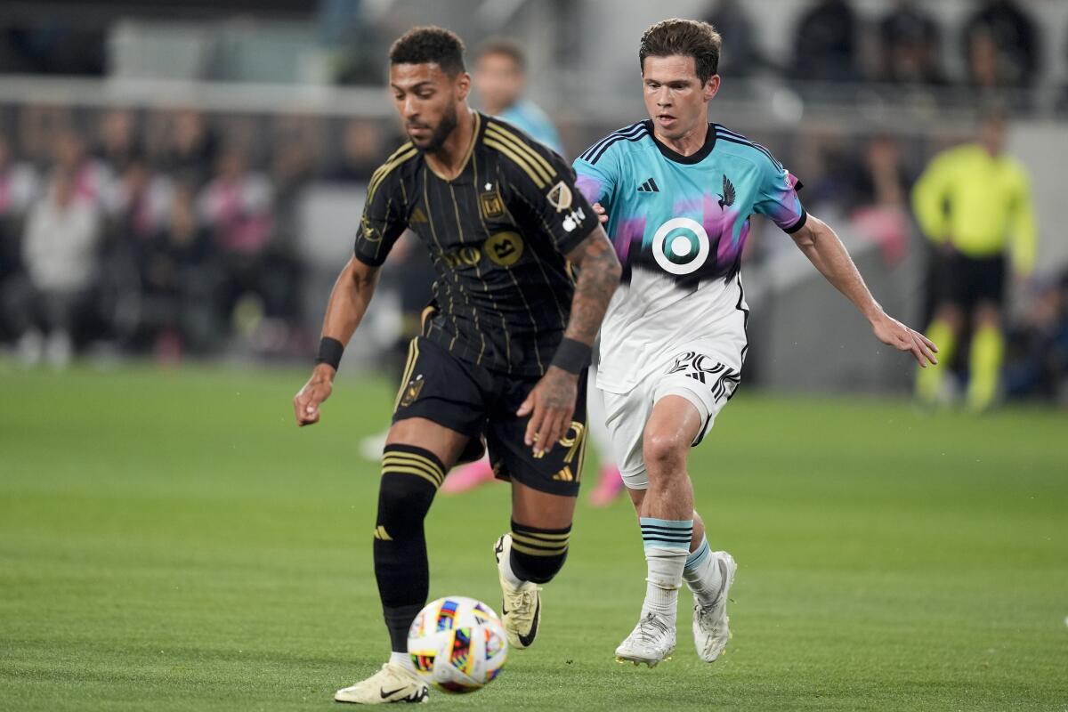 LAFC forward Denis Bouanga controls the ball during a match against Minnesota.