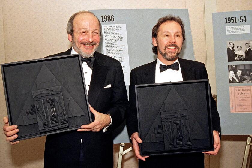 Authors E.L. Doctorow, left, and Barry Lopez pose with their American Book Awards, Nov. 17, 1986 in New York.