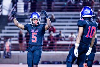 Let the playoffs begin. Isaiah Rubin (5) of Los Alamitos is excited after interception against Edison.
