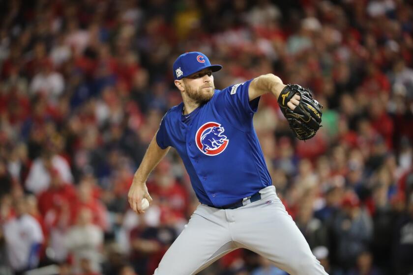 Chicago Cubs relief pitcher Wade Davis (71) delivers in the eighth inning on Thursday, Oct. 12, 2017 in Game 5 of their National League Division Series playoff at Nationals Park. (Brian Cassella/Chicago Tribune) Cubs Nationals NLDS