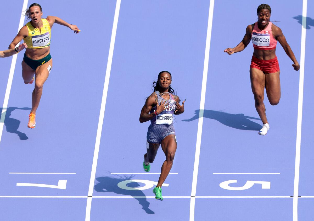 America Sha'carri Richardson easily wins her women's 100-meter heat at the 2024 Paris Olympics Friday. 