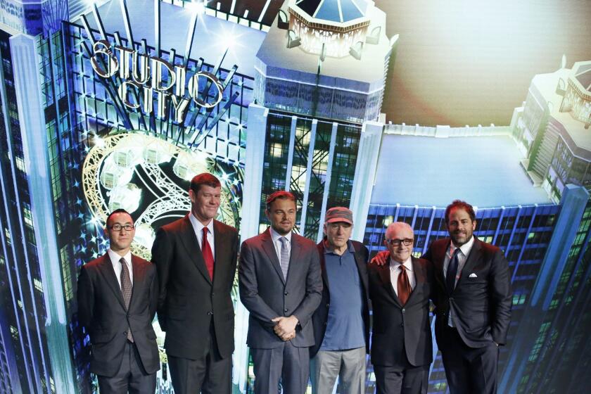 Melco Crown Entertainment co-chairman and chief executive Lawrence Ho and co-chairman James Packer pose with film stars Leonardo DiCaprio, Robert De Niro, director Martin Scorsese and producer Brett Ratner during a launch ceremony of the Studio City project in Macau.
