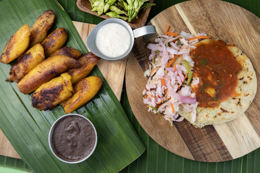 LOS ANGELES, CA - OCTOBER 01: Fried plantains and queso and loroco pupusa at Delmy's Pupusas in Los Angeles, CA on Tuesday, Oct. 1, 2024. (Myung J. Chun / Los Angeles Times)