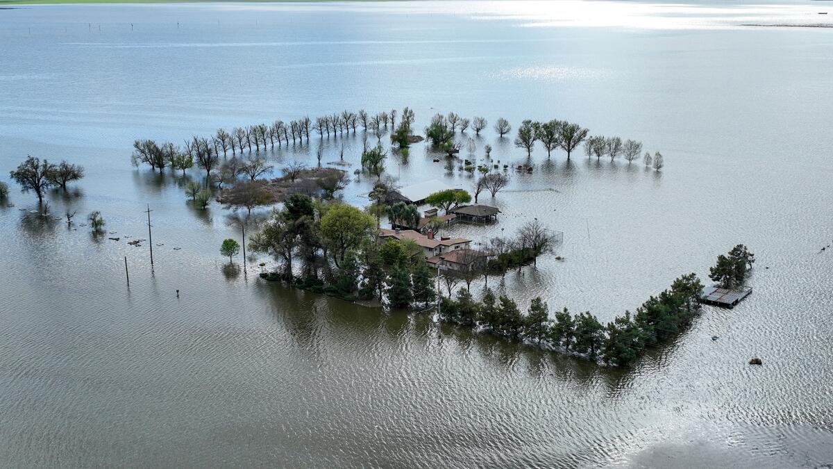 An estate in Corcoran remains flooded as the resurgence of Tulare Lake continues.