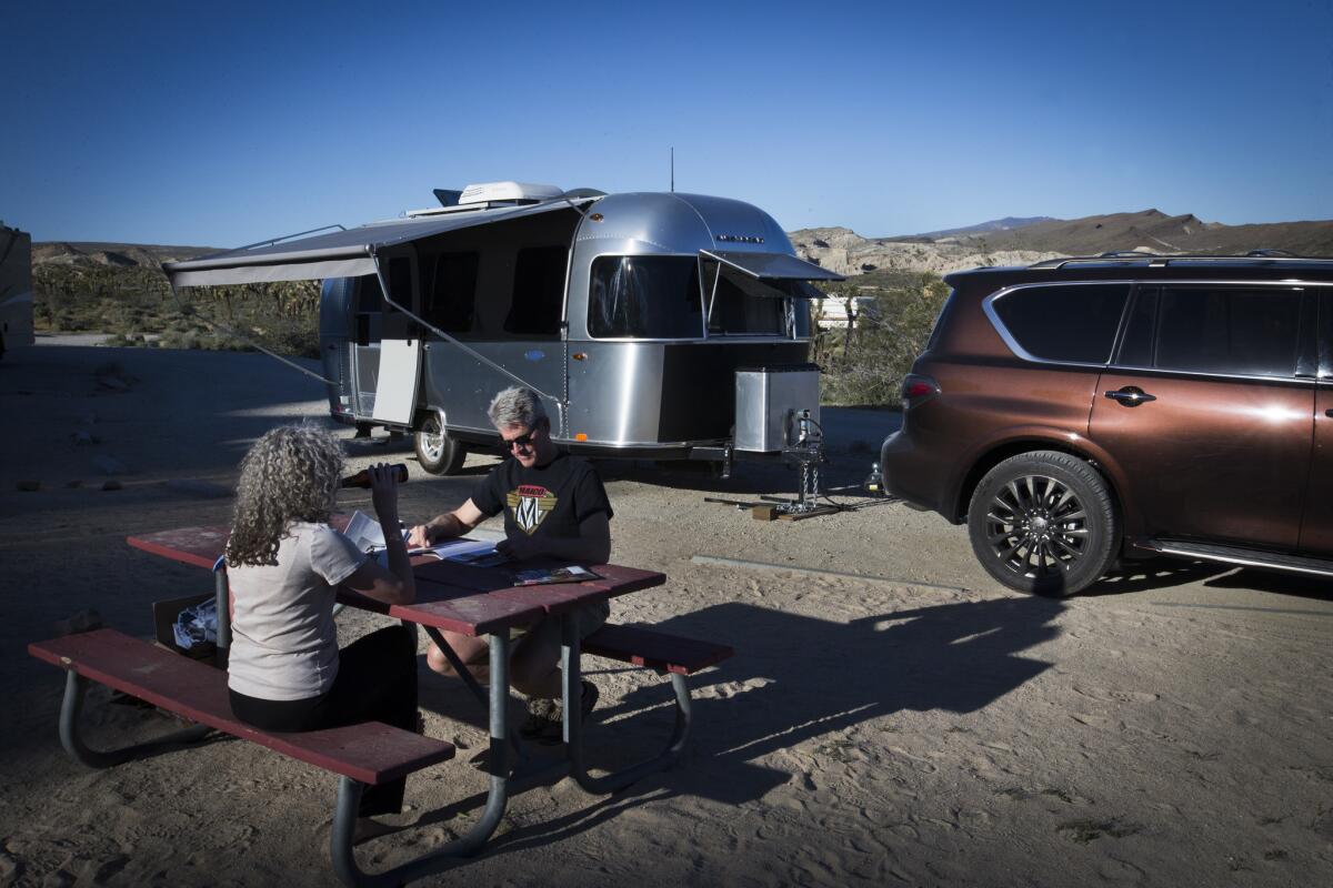 Charles and Julie Fleming camp in an Airstream Bambi Sport at Red Rock Canyon Ricardo campground in the Red Rock Canyon State Park near Mojave. (Allen J. Schaben / Los Angeles Times)
