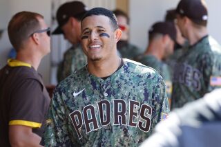 SAN DIEGO, CA - OCTOBER 2: San Diego Padres' Manny Machado smiles in the dugout during a game against the Chicago White Sox at Petco Park on Sunday, October 2, 2022 in San Diego, CA. (K.C. Alfred / The San Diego Union-Tribune)