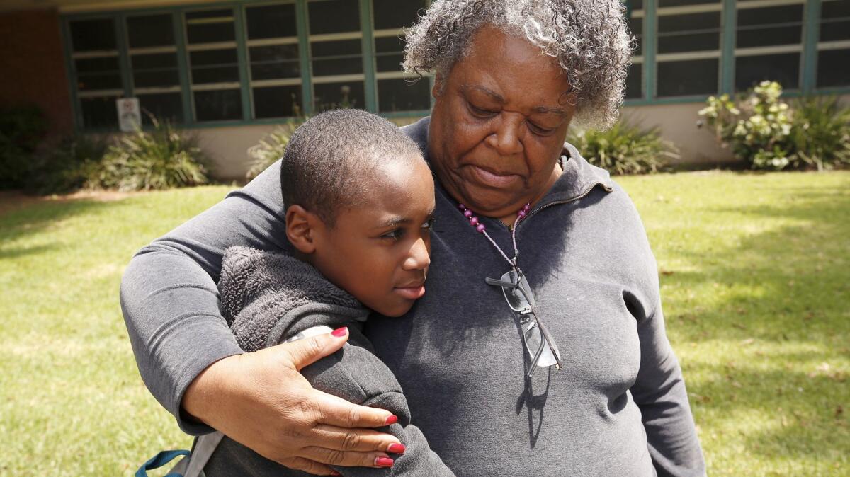 Annie Hall, right, wth her son Deartonne Graves, 11, a sixth-grade student at Daniel Webster Middle School on Los Angeles' Westside.