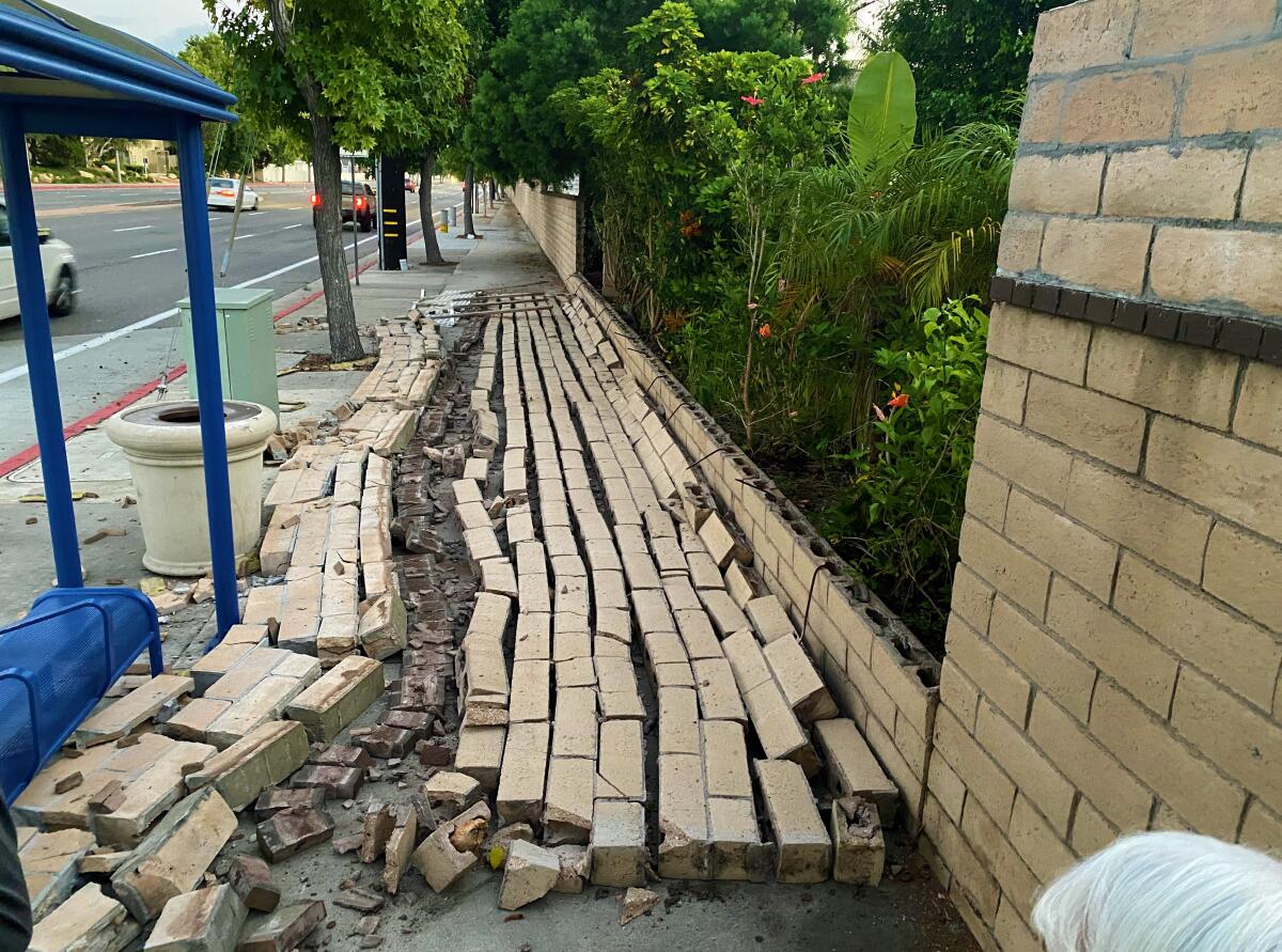 A residential wall along Costa Mesa's Fairview Road, thought to have been built around 1980, collapsed Sept. 3.