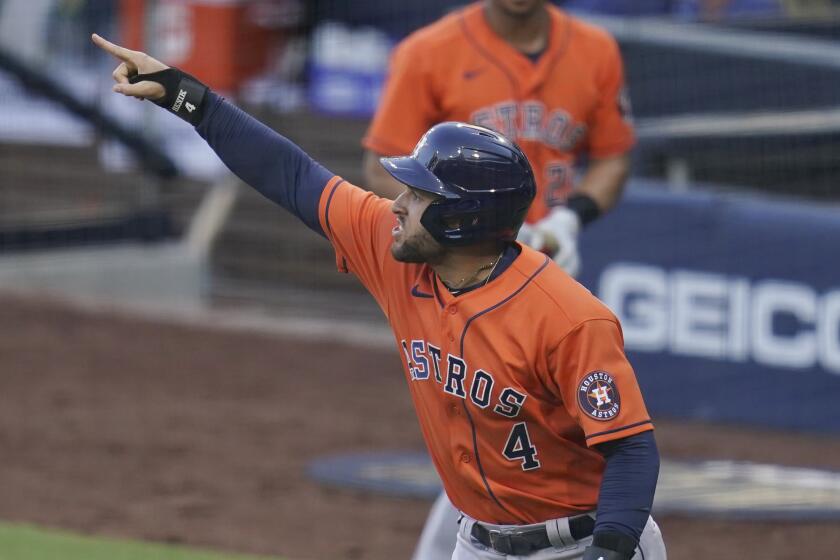 George Springer celebrates after scoring on a double by Jose Altuve in Houston's win over Tampa Bay in Game 6 of the ALCS.
