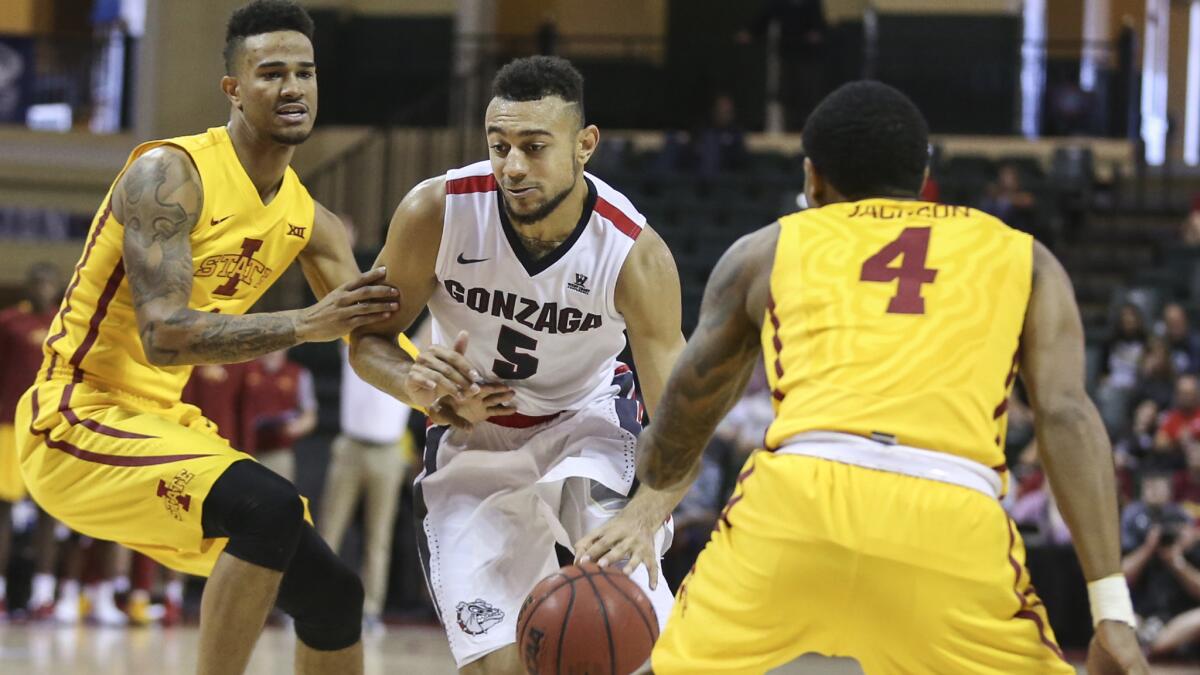Gonzaga guard Nigel Williams-Goss tries to drive between Iowa State guards Nazareth Mitrou-Long, left, and Donovan Jackson (4) during the second half Sunday.