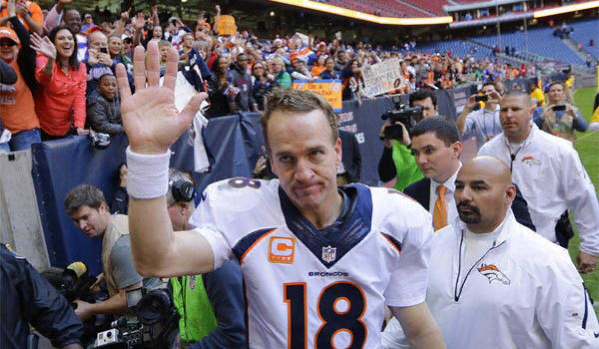 Denver quarterback Peyton Manning waves to fans after playing against the Texans in Houston on Dec. 22.