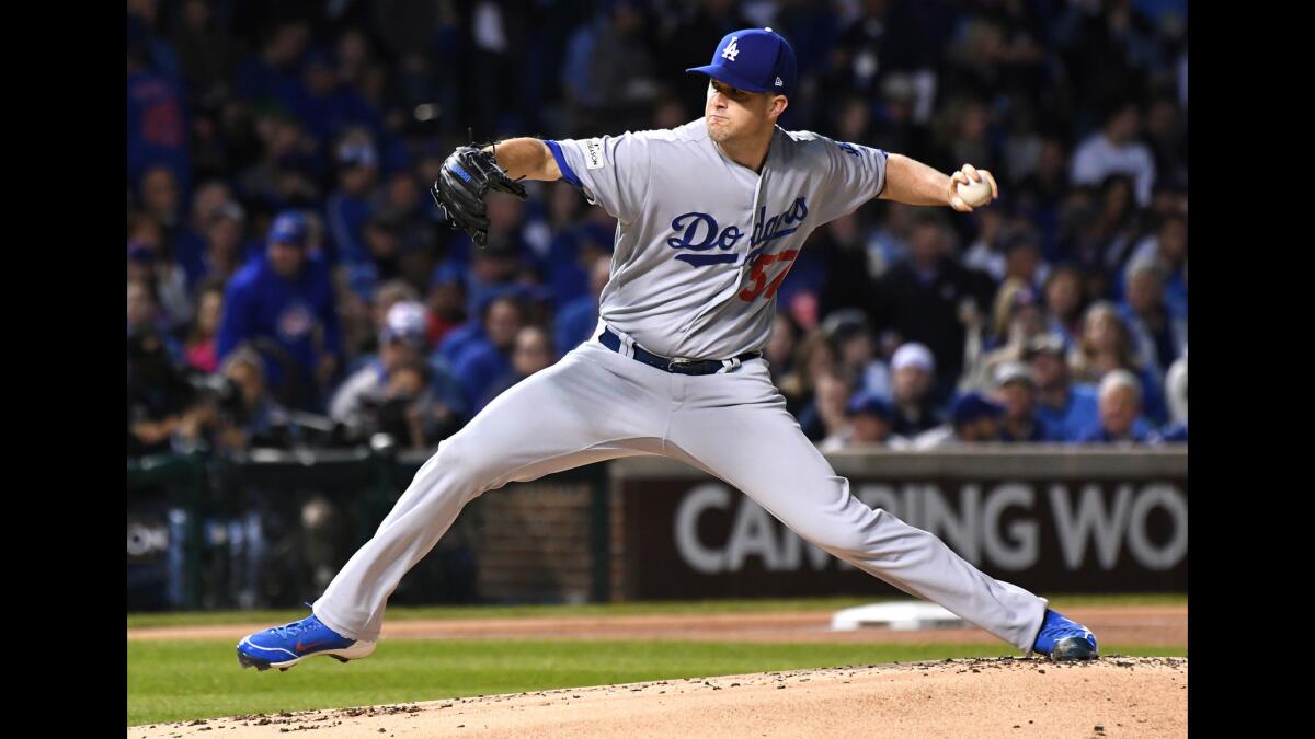 Alex Wood throws in the first inning.