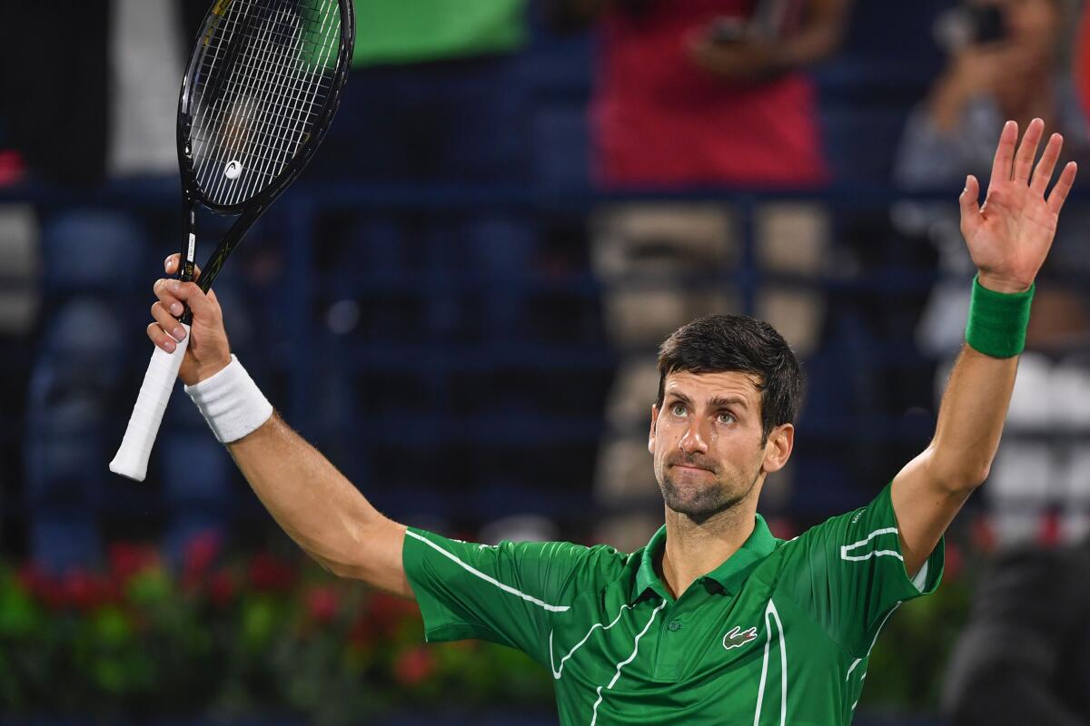 Serbia's Novak Djokovic reacts after winning the match against Germany's Philipp Kohlschreiber during the Dubai Duty Free Tennis Championships in the United Arab Emirates on February 26, 2020. (Photo by KARIM SAHIB / AFP) (Photo by KARIM SAHIB/AFP via Getty Images) ** OUTS - ELSENT, FPG, CM - OUTS * NM, PH, VA if sourced by CT, LA or MoD **