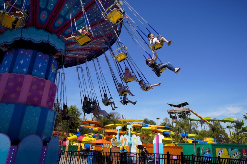 Chula Vista, CA - March 25: On Friday, March 25, 2022 in Chula Vista, CA., at Sesame Place San Diego, passengers on board Abby's Fairy Flight enjoy their flight above the park. (Nelvin C. Cepeda / The San Diego Union-Tribune)