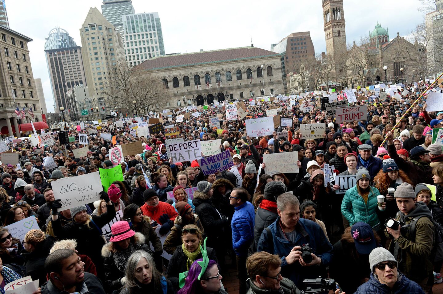 People gather in Boston's Copley Square to protest the travel ban enacted by President Trump.