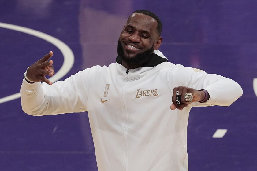 Los Angeles, CA, Tuesday, December 22, 2020 - Los Angeles Lakers forward LeBron James (23) exults after receiving his championship ring during an on court ceremony at Staples Center. (Robert Gauthier/ Los Angeles Times)